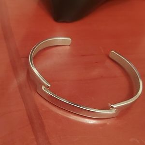 Avon silver tone bangle